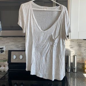 Over sized off white/cream t shirt with pocket on front left chest